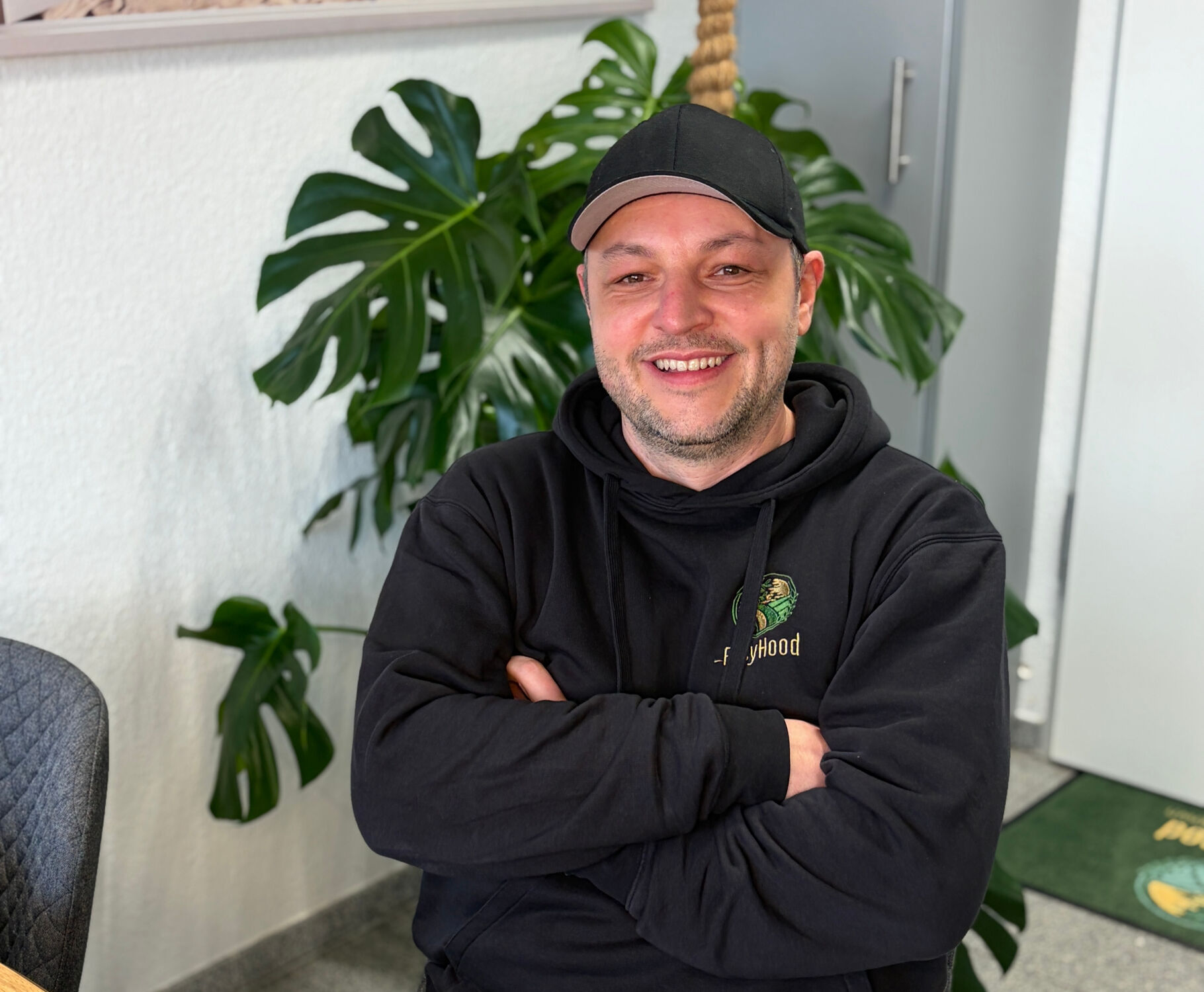 Two women in a contemporary office engaging in work-related activities.